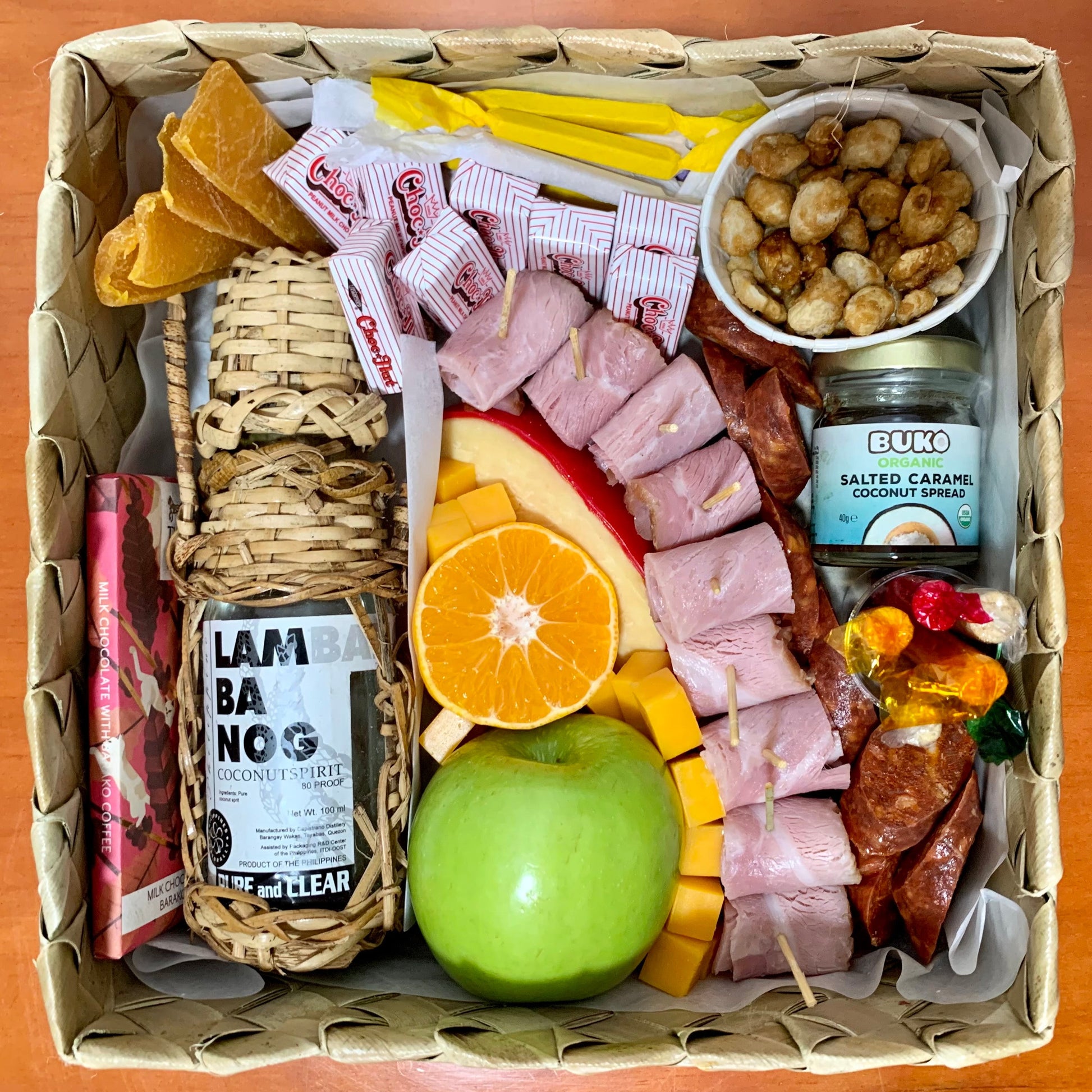 Grazing box with cheeses, cold cuts, fruits, nuts, and other treats